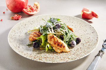 Warm salad with grilled chicken breast fillet
