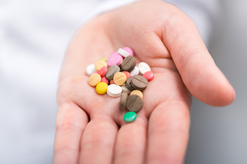 Photo of doctor prescribes pills and antibiotics