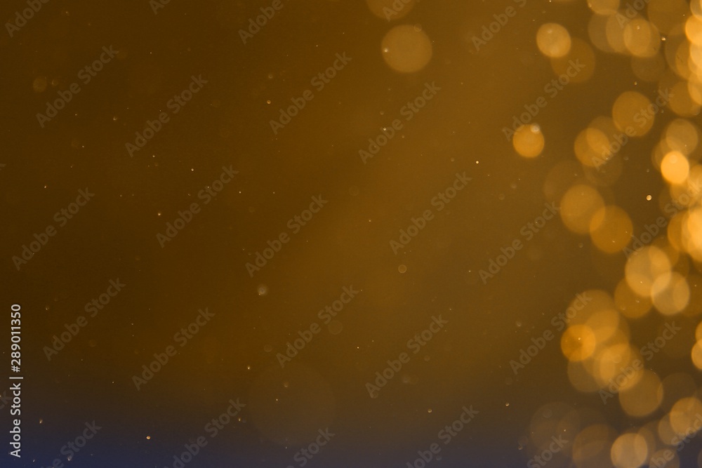 Wall mural orange shining sparkles one side frame bokeh texture - nice abstract photo background