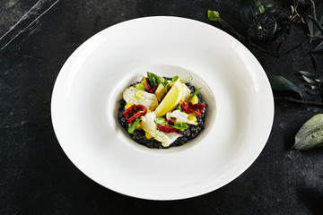 Black Risotto with Octopus and Sun Dried Tomatoes