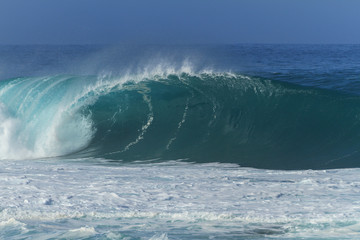 huge wave breaking in hawaii at the famous Banzai Pipeline beach