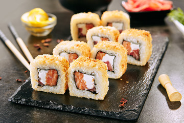 Crispy Tempura Maki Sushi Rolls or Uramaki with Raw Salmon