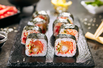 Hot Spicy Uramaki Sushi Rolls in Japanese Restaurant Closeup