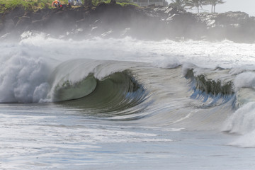 huge stormy waimea shore break wave in hawaii