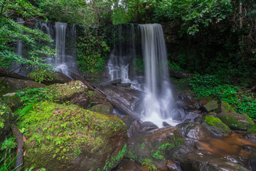 Fototapeta na wymiar Waterfall scene at Rom Klao Pharadon Waterfalls in rainforest Thailand