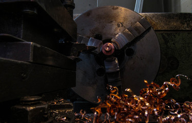 old soviet lathe and metal brass chips on it