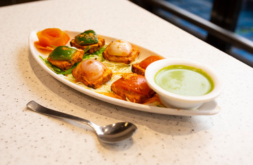 Indian Starter Dish Paneer Tikka Kabab or Paneer Cubes Made From Chunks of Cottage Cheese Marinated in Spices & Grilled in a Tandoor Served With Green Chutney