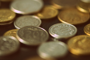 Polish coins scattered on a dark background close up. Retro style