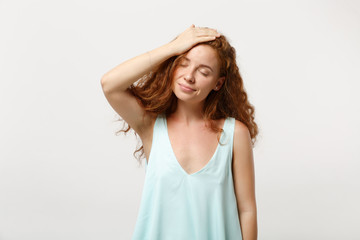 Young smiling redhead woman girl in casual light clothes posing isolated on white background studio portrait. People lifestyle concept. Mock up copy space. Putting hand on head, keeping eyes closed.