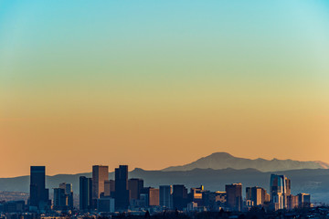 Denver skyline against a background of mountains