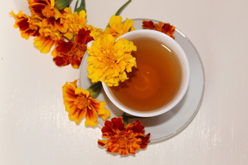 Delicious tea in a white Cup on a saucer.
