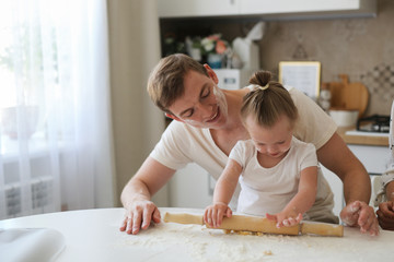 gentle loving dad hugs his daughter kitchen