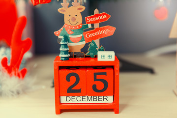 Christmas calendar with 25th December on wooden blocks.