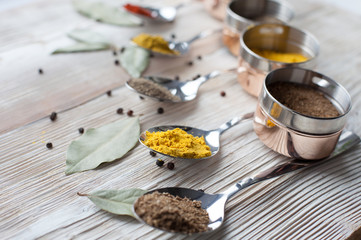 spices on a wooden light background photo