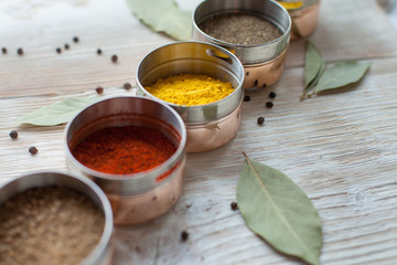 spices on a wooden light background photo