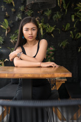 Asian girl  in a cafe. Beautiful Balinese women.