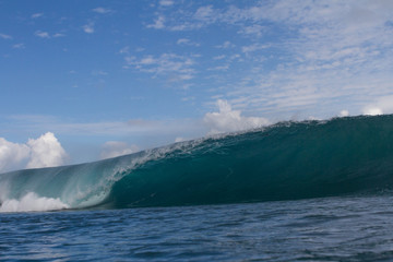 Huge dangerous wave breaking on a reef in Indonesia