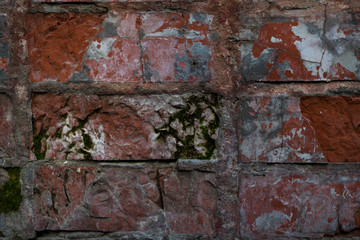 Texture of an old paint covered brick wall. Background image of an abandoned brick wall with painted over paint