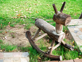 Wooden rocking horse made by old wood.