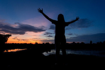Fototapeta premium Photo Silhouette woman feeling beautiful evening.