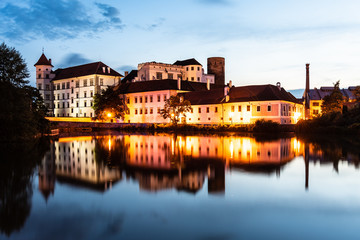 Fototapeta na wymiar Jindrichuv Hradec Castle by night. Reflection in the water. Czech Republic