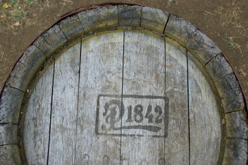 Old wine barrel. Vintage oak barrel made in 1842