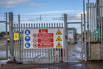 Great Yarmouth, Norfolk, UK – September 08 2019. No entry gate and metal security fence around an industrial unit in the Southtown Road region of Great Yarmouth restricting access