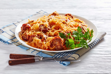 spicy Cabbage stew with sausages on a plate