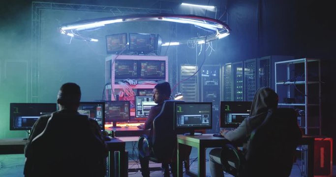 Young men hacking in a basement