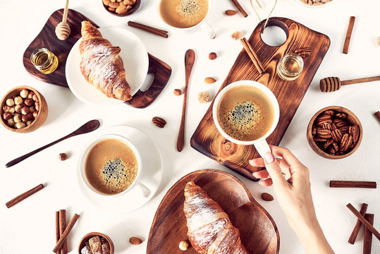breakfast pattern, croissant, coffee, honey, cinnamon sticks, nuts, sugar. Good morning concept. © conssuella