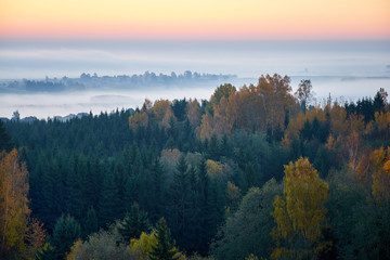 Morning landspace with sun rays. Beautiful landscape with forest and fog.Lithuanian landscape.