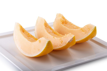 Fototapeta na wymiar Slices sweet yellow melon isolated on white background