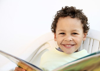 boy with school book going back to school on white background stock photo