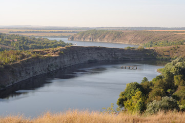 View of a winding river among steep banks