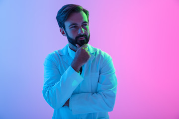 Portrait of a confident young man doctor wearing uniform