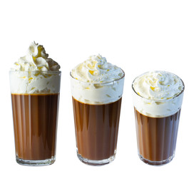 Cappuccino coffee with whipped cream in a tall glass. Isolate on a white background. The photo.