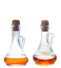 Apple cider vinegar in a special glass bottle. Corkwood. Isolate on a white background. The photo.
