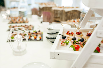 Luxury food and drinks on corporate party table.