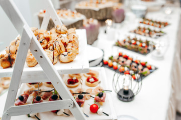Luxury food and drinks on corporate party table.