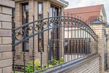 Forged decorative iron fence. Beautiful decorative  wrought fence with artistic forging