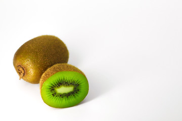 Obraz premium kiwi one pieces and cut half isolated on white background