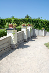 Enjoyable garden wall next to gravel walkway in sunny summer