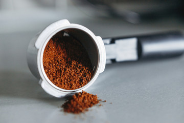 Macro coffee machine handle with ground coffee. Coffee Filter Holder for Espresso