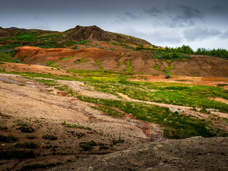 Geysers and steam in Icelandic landscape