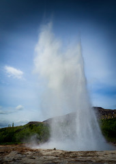 Geysers and steam in Icelandic landscape