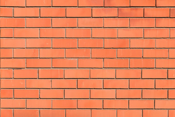 Fototapeta premium New ordinary red brick wall with gray concrete seam.