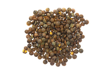 Macro flatlay image of brown lentils pile isolated at white background.