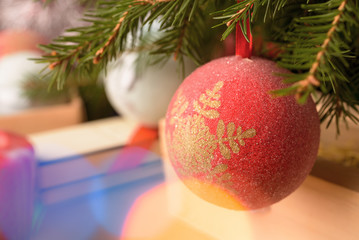 Christmas mood picture with christmas ball and flares. Selective focus