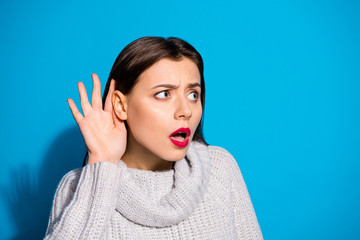Closeup photo of pretty lady listening concentrated rumours wear knitted pullover isolated blue...