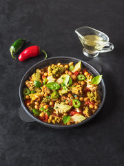 Nutty roasted romanesco curry in a black background. Top view. 